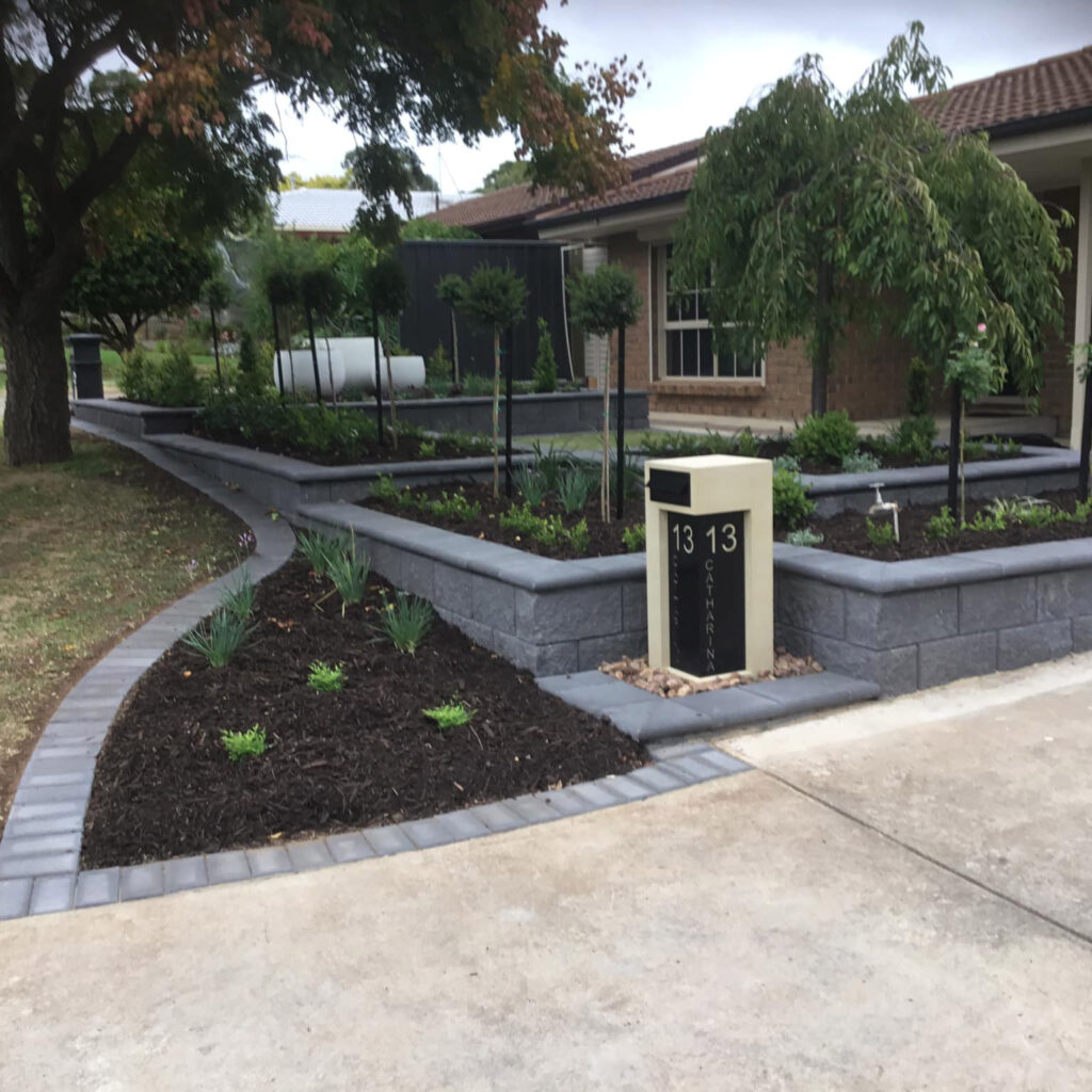 Versawall Charcoal Stradapave Bullnose Havebrick Charcoal Edging After | Evergreen Landscaping